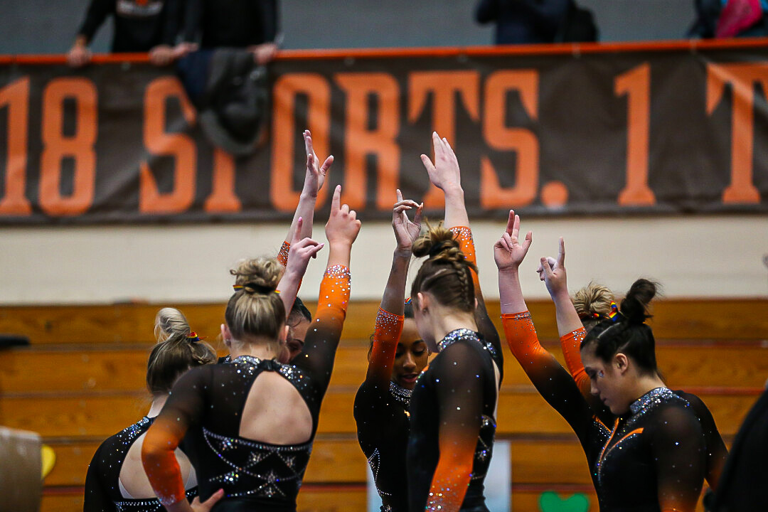 Team huddle with hands in 